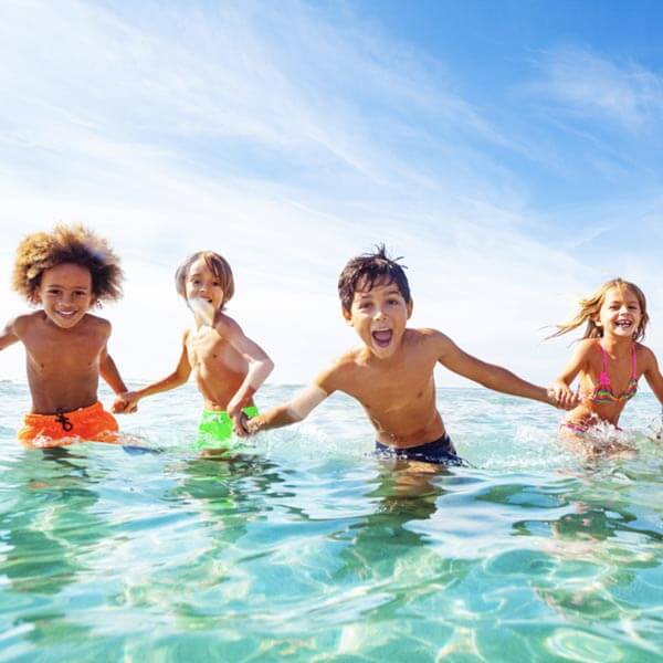 Children playing in the ocean